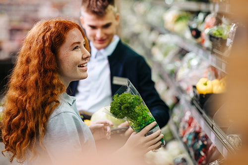 Trainees helping each other in the produce section