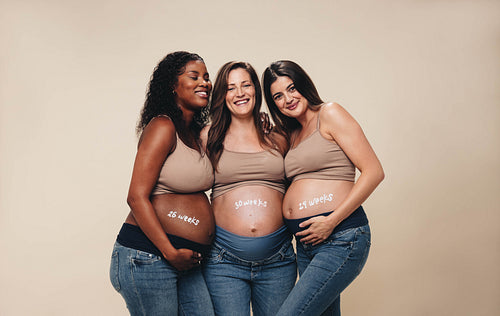 Third trimester happiness: Multicultural pregnant women in a maternity shoot
