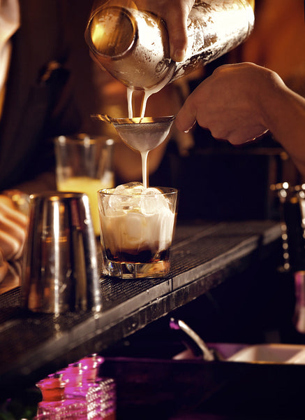 Bartender Making a Cold Cocktail Drink