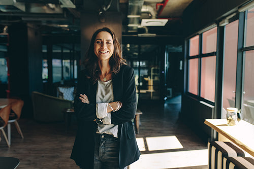 Successful businesswoman standing in office