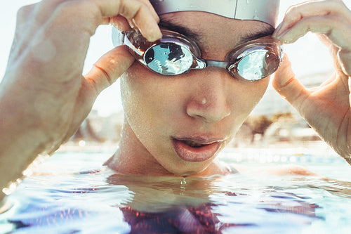 Swimmer taking a break while swimming practice