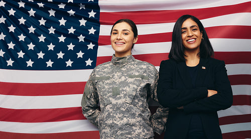 Happy soldier and politician standing against the American flag