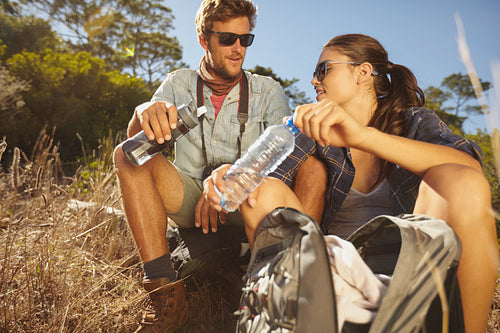 Young couple taking a break on a hike