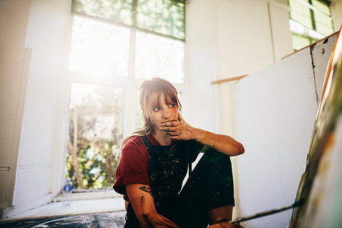 Female painter working in studio