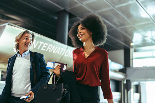International business travelers at airport terminal