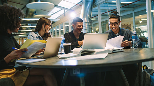 Group of multiracial students in college library