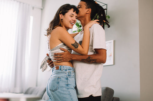 Happy young couple at home
