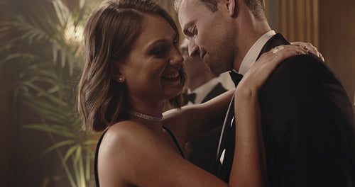 Couple in love dancing sensually at a party