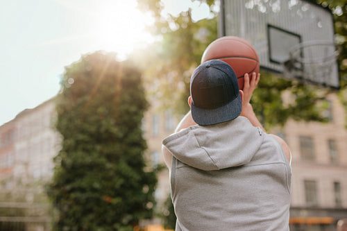 Young guy playing basketball
