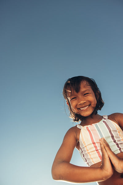 Little girl enjoying herself on a beach day