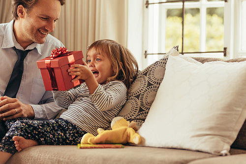 Father and daughter sitting at home