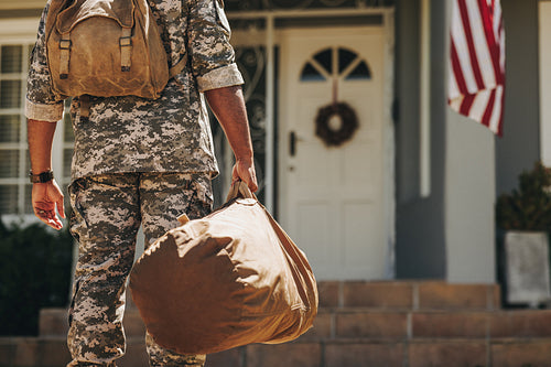 Unrecognizable soldier returning home from the army