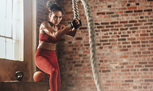 Woman exercising hard for perfect body