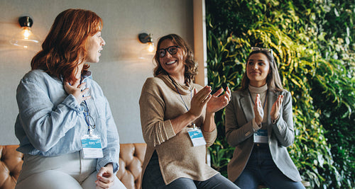 Successful group of business women engaged in productive discussion
