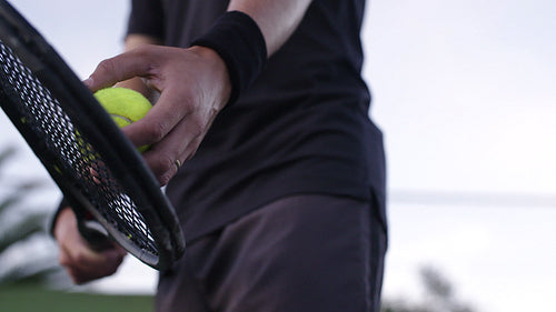 Focused tennis player ready to serve