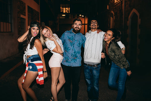 Young friends hanging out in outdoor party