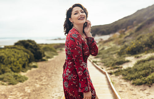 Sensual woman posing against a beautiful landscape