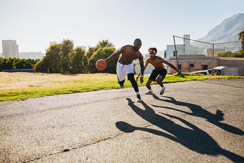 Men playing basketball