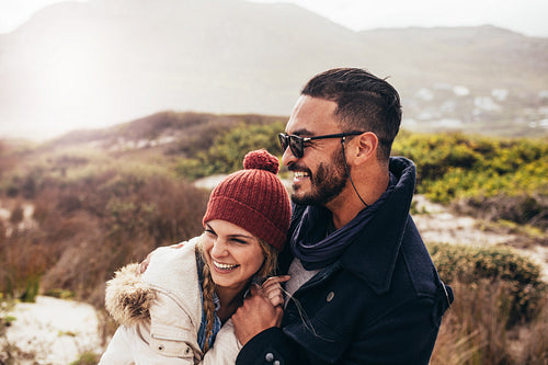 Couple enjoying a winter day at the beach
