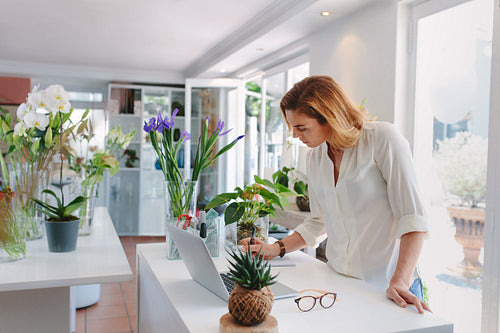 Woman working in plant nursery