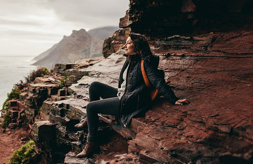 Beautiful woman contemplating the view from mountain