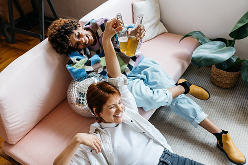 Colleagues laughing during a break in a modern co-working space
