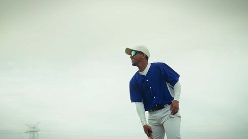 Baseball batter practices his powerful swing