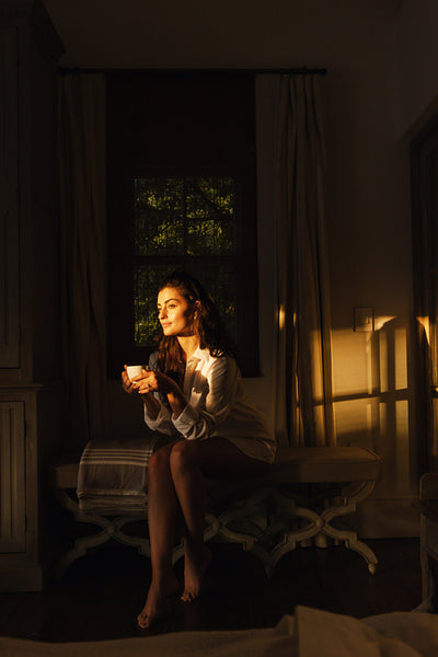 Young woman relaxing in her hotel room
