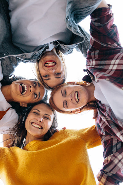 Group of cheerful women in a huddle