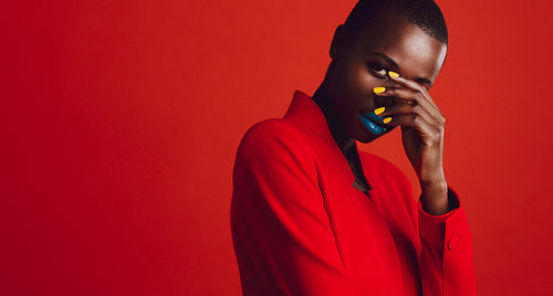 Glamorous female model on red background