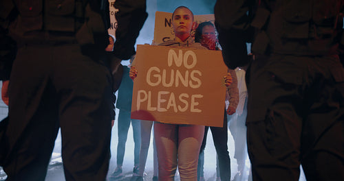 People protesting on banning weapons