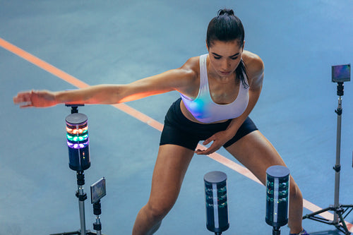 Athlete using visual stimulus system at sports lab