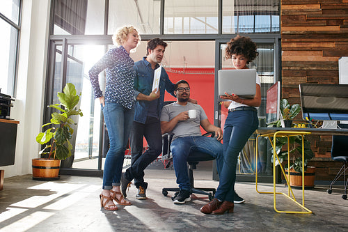 Multiracial group of designers meeting in modern office