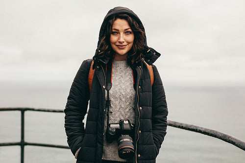 Woman tourist at mountain top on a winter day