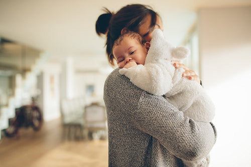 Newborn boy in his mother's arms