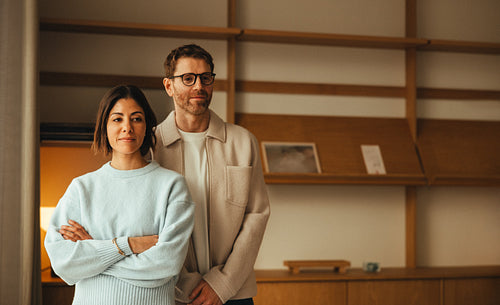 Business partnership portrait, colleagues side by side in office