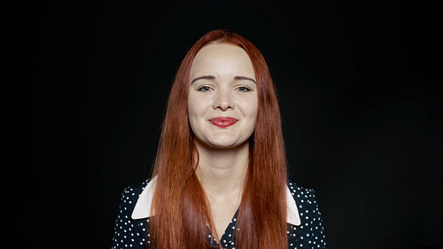 Beautiful woman laughing on black background