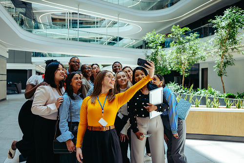 Group of new hires taking a selfie at an accounting firm