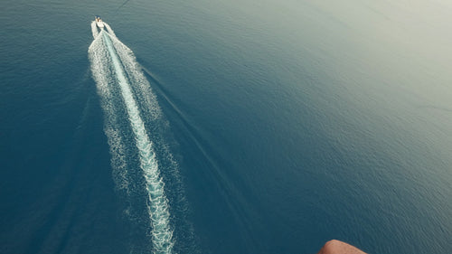 Parasailing high above the ocean with stunning views of the beautiful blue water