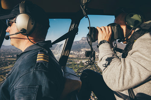Photographing a pilot flying helicopter