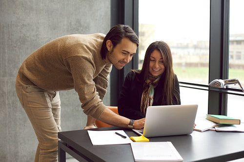 Students studying together with laptop