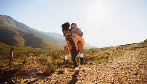 Friends hiking and laughing in nature
