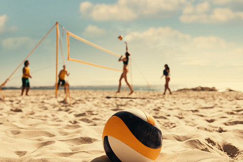 Coastal championship: International pro volleyball players training on beach sand