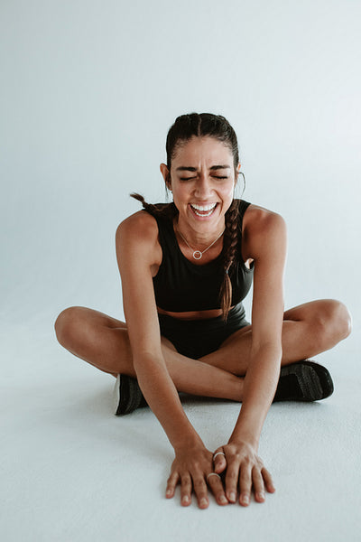 Healthy female relaxing after exercising session