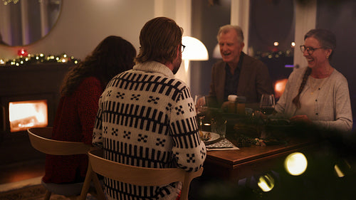 Family together having Christmas dinner