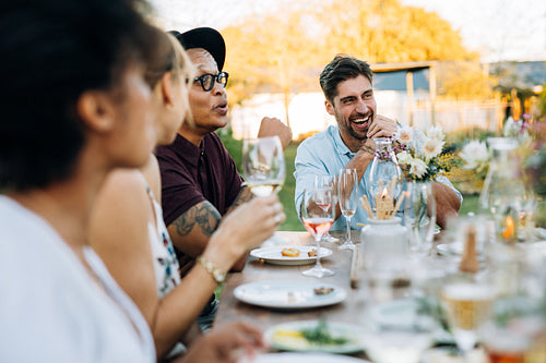 Friends enjoying outdoor summer meal