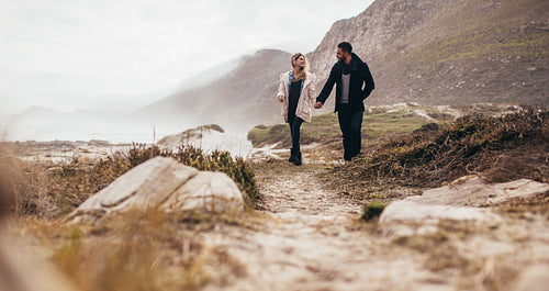 Couple strolling on beach