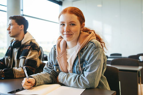Young woman sitting in her classroom