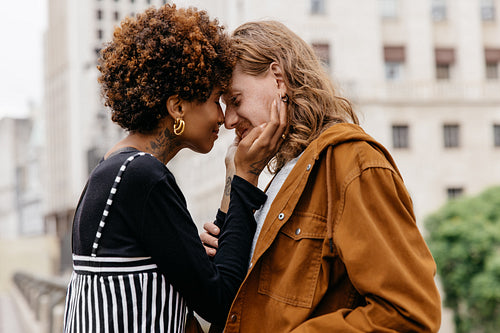 Affectionate couple embracing in city surroundings