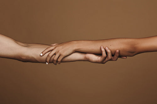 Couple tenderly holding hands